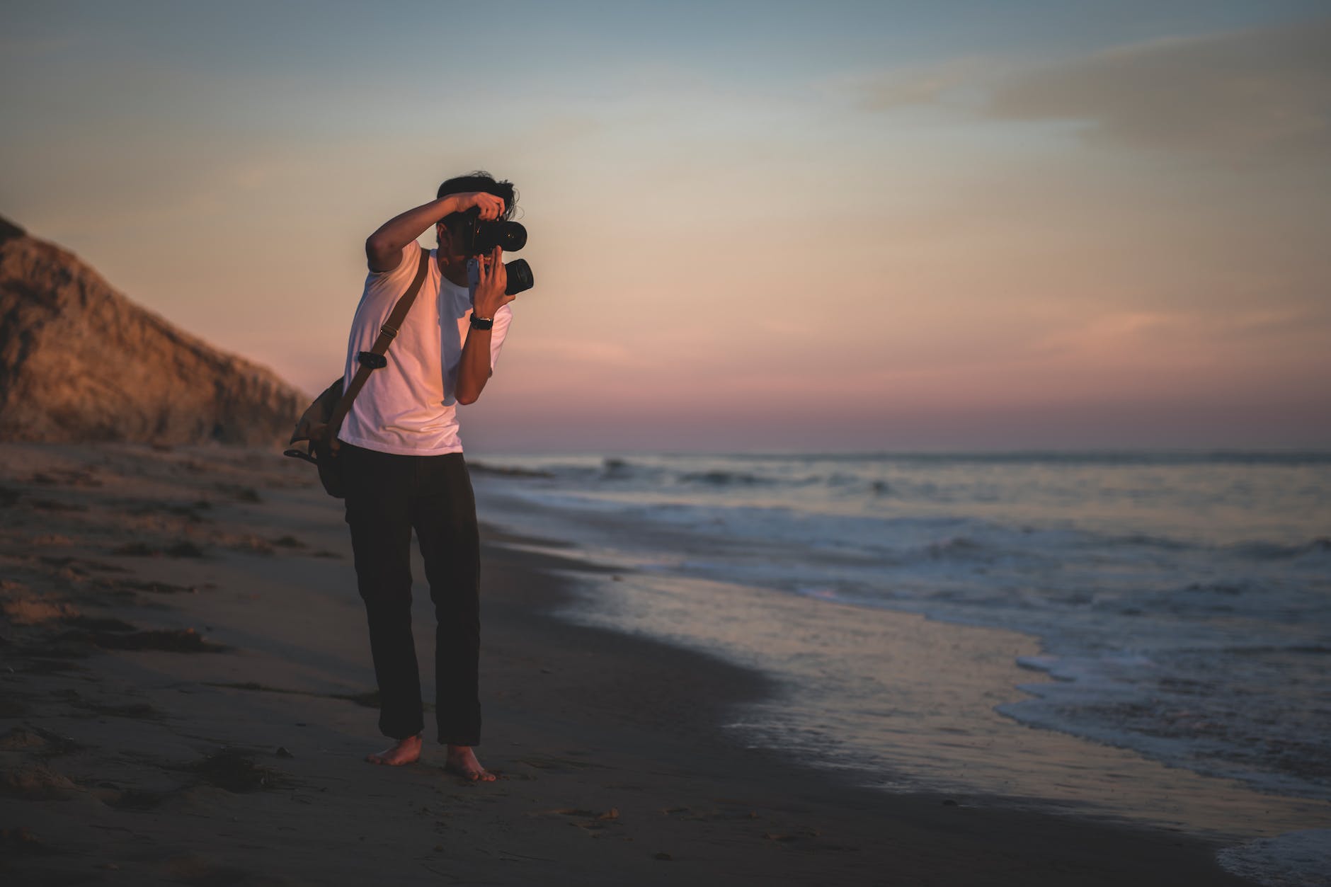 man taking photo outdoors